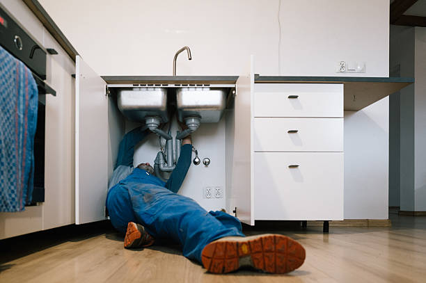Professional Drain Cleaning technician working in Laton, CA